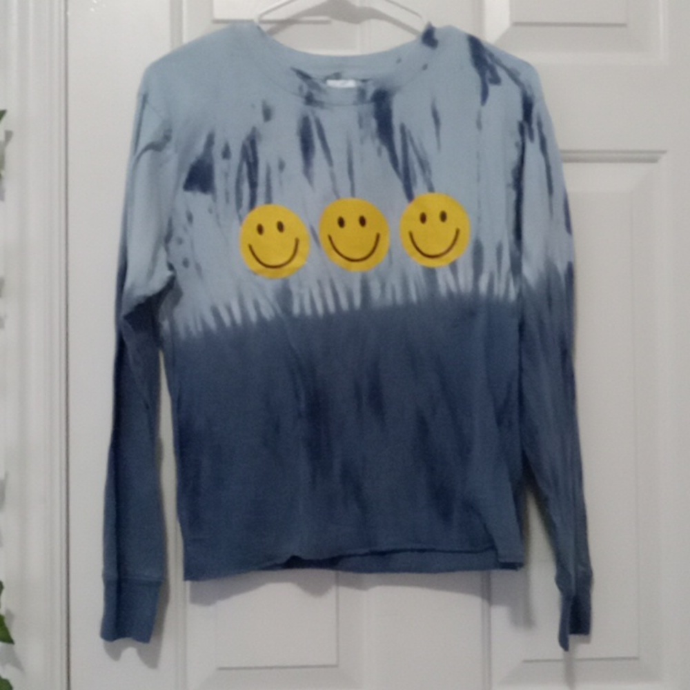 Blue long sleeve with three smiley faces.